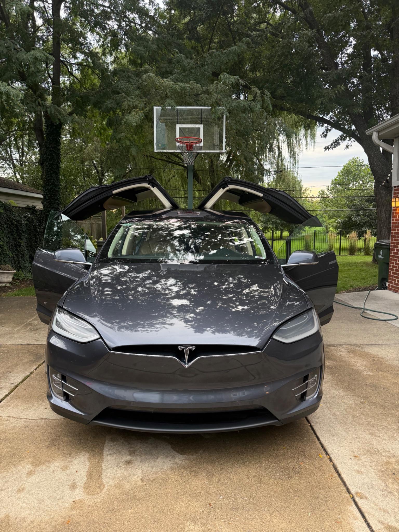 Detailed Tesla with polished dark paint